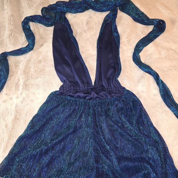 Blue shimmery romper with long tie down the back. - Picture 2 of 6